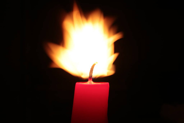 Red candle burns fire background - Photo, Image