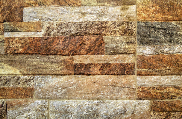 ein Hintergrund aus bunten Steinmauern Nahaufnahme - Foto, Bild