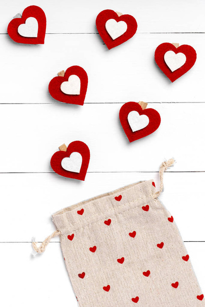 Valentines Day composition. Heart, gift on white wooden surface. Valentine's day concept. Flat lay, top view, from above - Photo, Image