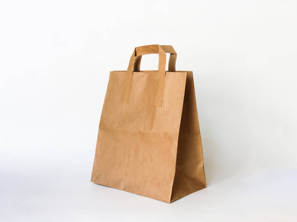 Empty Kraft Paper Bag for advertising and branding isolated on white Background. Mock up. High Resolution. Mockup for design - Photo, Image