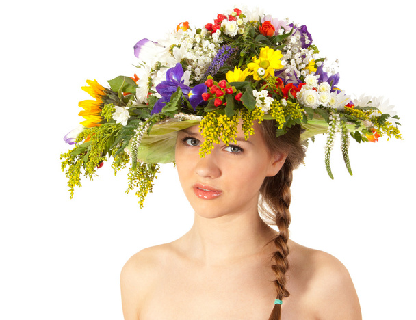 Beautiful girl with hat of flowers - Фото, изображение