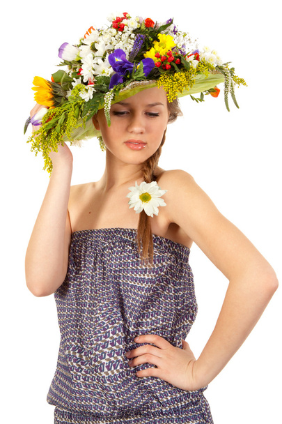 Beautiful girl with hat of flowers - Фото, изображение