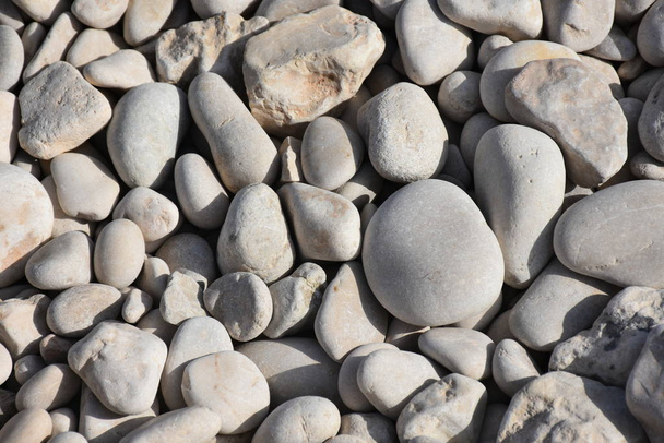mořské kameny na pláži a textury a pozadí - Fotografie, Obrázek
