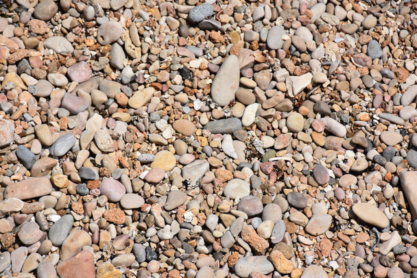 zee stenen op het strand en textuur en achtergrond - Foto, afbeelding