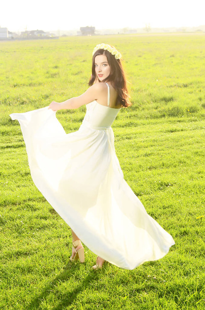 young beautiful woman in fashionable dress posing outdoors   - Φωτογραφία, εικόνα