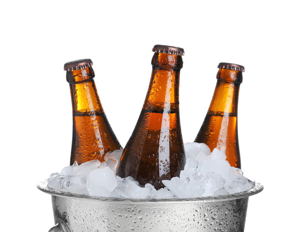 Beer in metal bucket with ice isolated on white - 写真・画像
