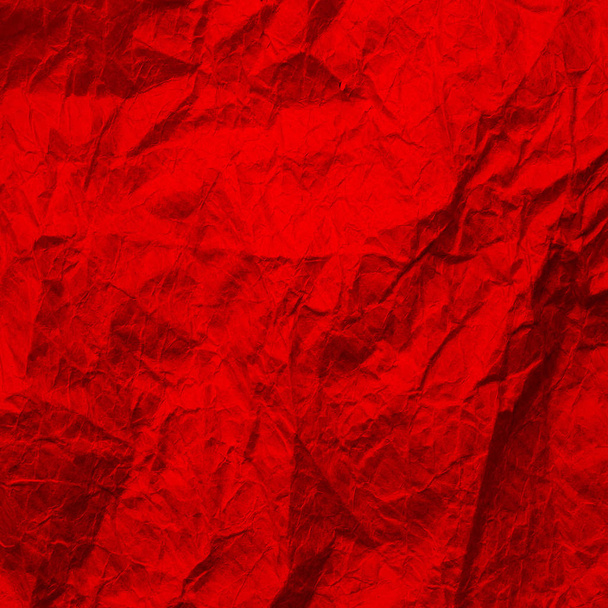 Kırmızı buruşuk kağıt. Kırmızıya dokuma kağıdı. Arkaplanda geri dönüştürülmüş kağıt.  - Fotoğraf, Görsel