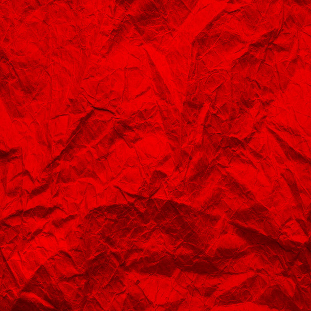 Kırmızı buruşuk kağıt. Kırmızıya dokuma kağıdı. Arkaplanda geri dönüştürülmüş kağıt.  - Fotoğraf, Görsel