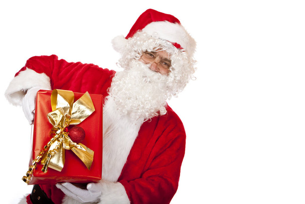 Old happy Santa Claus holding Christmas gift in hands - Foto, immagini