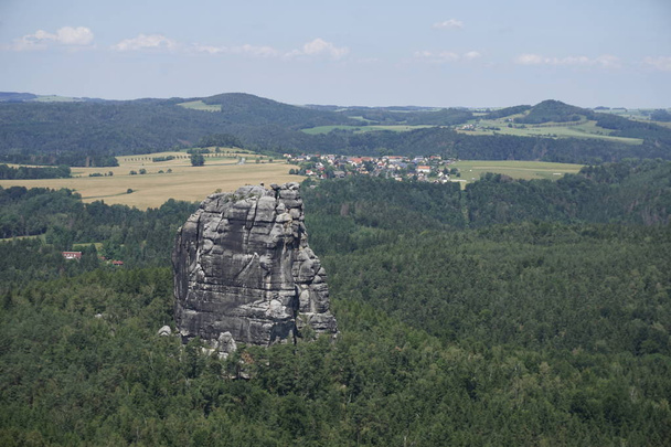 View to the Falkenstein mountain and over green hills in Saxon Switzerland - Фото, изображение