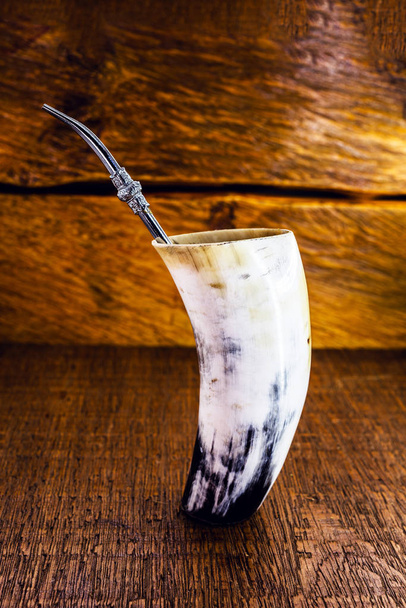 Cuia de Tereré or tererê, made with ox horn. It is a typical South American drink made with the infusion of yerba mate in cold water. Consumed in Santa Catarina, Paraná, Mato Grosso and Brasilia. - Valokuva, kuva