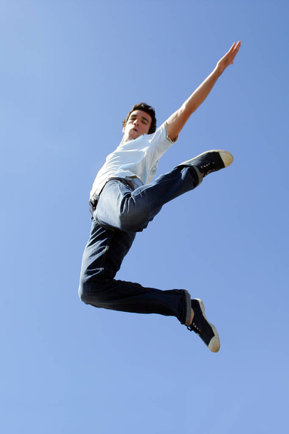 man jumping in the air face - 写真・画像