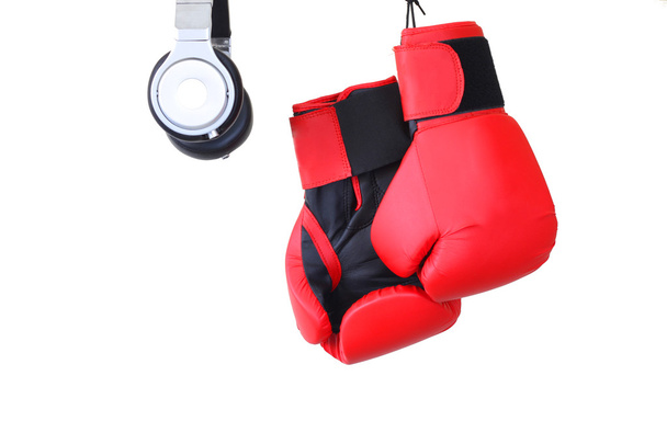 Pair of gloves and headset isolated in white - Photo, Image