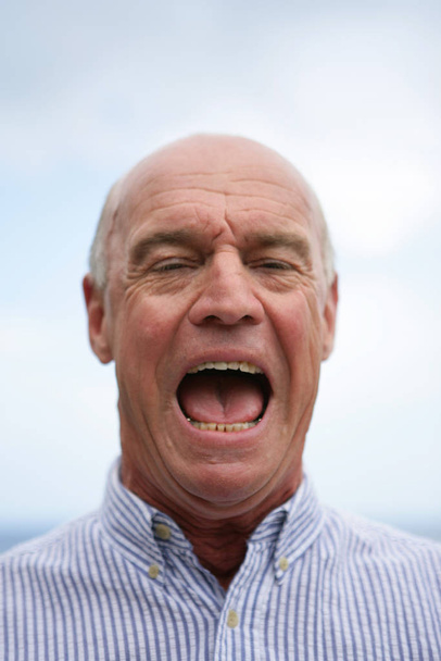 Portrait of a senior man in anger - Photo, Image