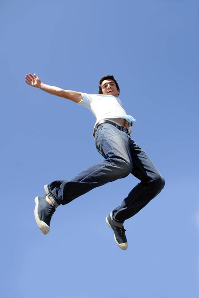 man jumping in the air face - Фото, зображення