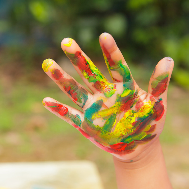 Hand with painted in colorful paint - Photo, Image