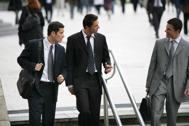 men in suits discussing them - Foto, Imagen