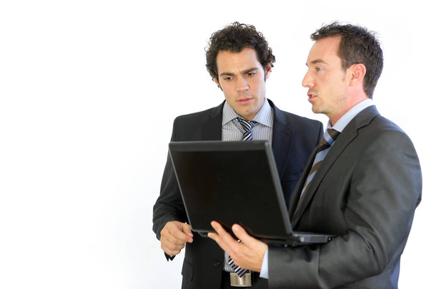 Portrait of men in suits in front of a laptop - Foto, imagen