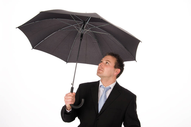 businessman with umbrella under the rain - Foto, imagen
