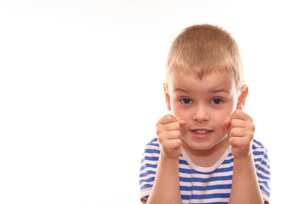 portrait of a cute little boy showing thumb up - Foto, Imagen