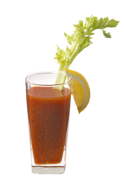 Bloody Mary mixed drink with celery and lemon garnish on white background - Zdjęcie, obraz