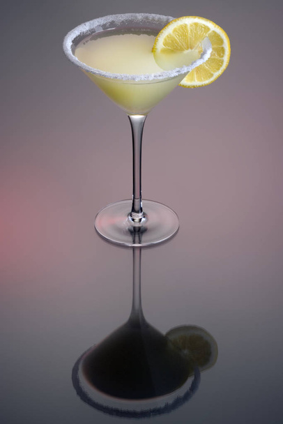 Sidecar cocktail with orange garnish on grey background - Photo, image