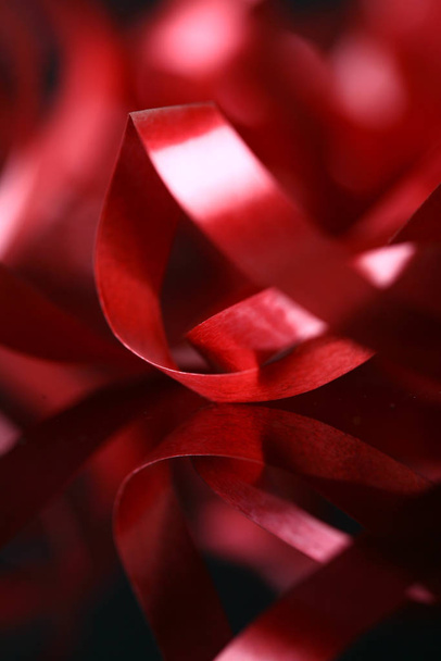red satin ribbon on background - Foto, afbeelding