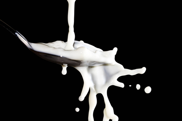 milk splash isolated on black background - Fotoğraf, Görsel