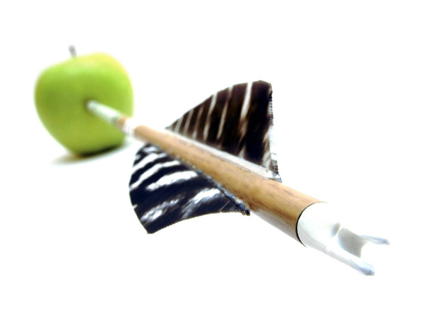 a close up of a wooden spoon with a green apple - Photo, Image