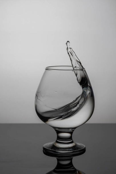 splash of water in a glass macro frozen motion - Photo, Image