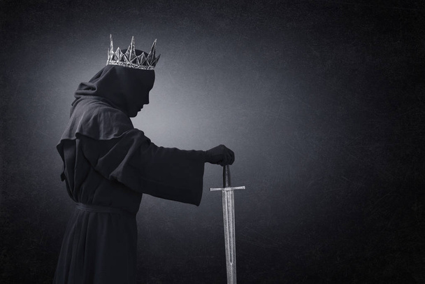 Ghost of a queen or king with medieval sword in the dark - 写真・画像