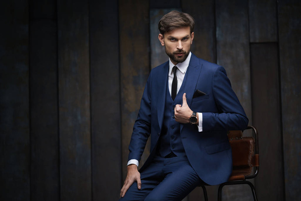 indoor photo of young handsome stylish businessman wearing suit - Foto, imagen