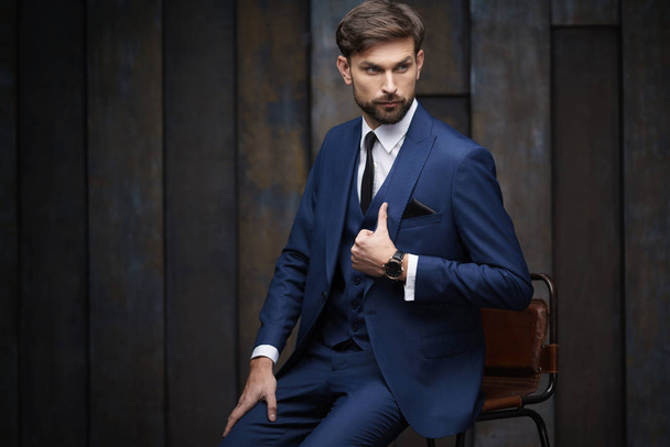 indoor photo of young handsome stylish businessman wearing suit - Foto, Bild