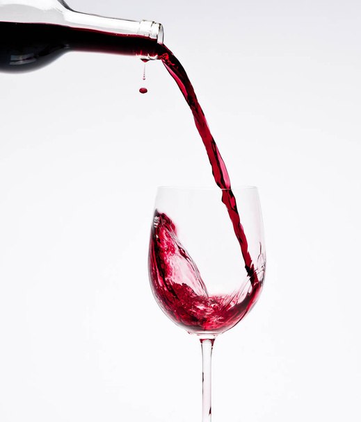 Red wine being poured - Foto, Imagen
