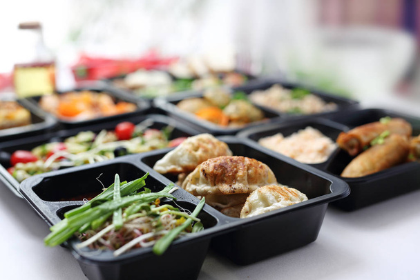 Catering. Appetizing lunch boxes. Food delivered to your doorstep - Photo, Image