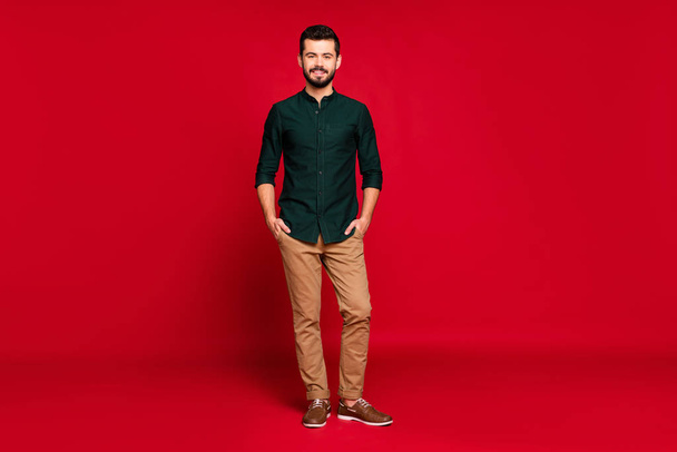 Full body photo of charming positive guy feel smart put his hands pocket wear good looking outfit isolated over vivid color background - Fotografie, Obrázek