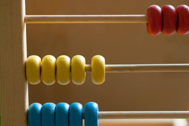 Closeup shot of a colorful old wooden abacus - Photo, image