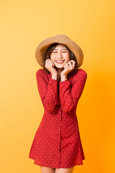 Asian girl feeling excited and surprised isolated on orange background.  - Photo, Image