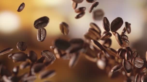 Raw coffee beans flying on the fire - Video, Çekim