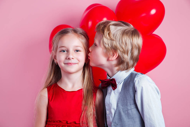 Little boy kissing beautiful little girl. Valentines day - Foto, imagen