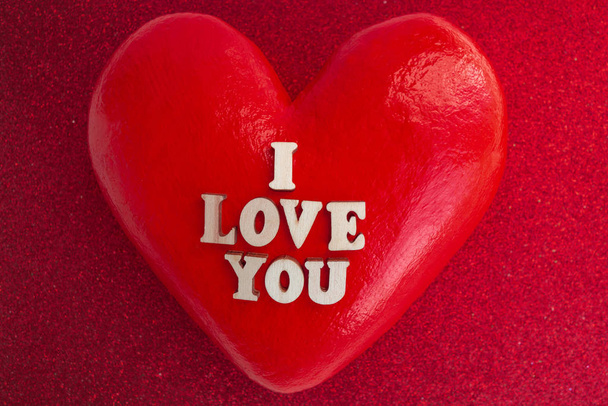 Big red heart with the inscription in wooden letters I love you. Happy Valentines Day. - Фото, изображение