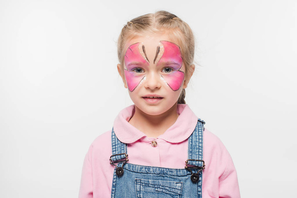 pensive child with butterfly painting on face looking at camera isolated on white - Photo, Image