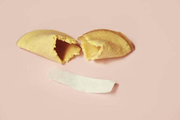 fortune cookie on pastel pink background - Photo, image