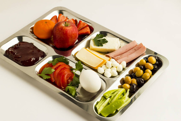 close-up shot of delicious various food on metal food tray (tabldot) on white - Photo, Image