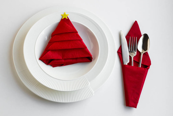 close-up shot of beautiful Christmas table setting with red napkin on table - Zdjęcie, obraz