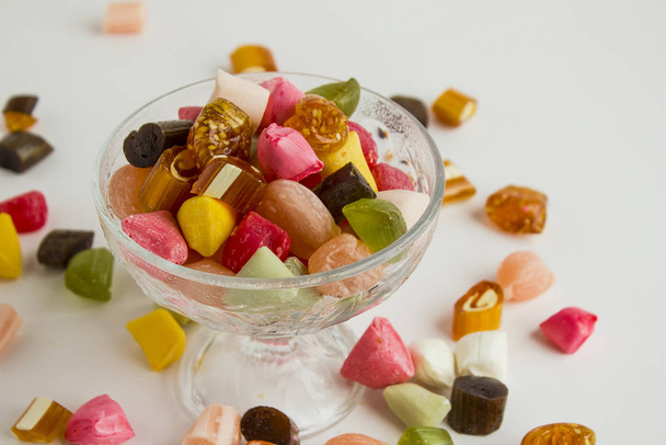 Traditional Turkish Colorful Hard Candy Akide in the glass candy bowl on white - Фото, зображення
