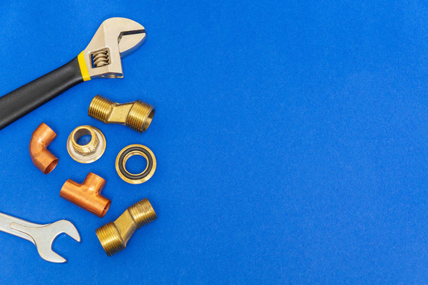 Set of tools for plumbing isolated on blue background with space for advertising - Fotoğraf, Görsel