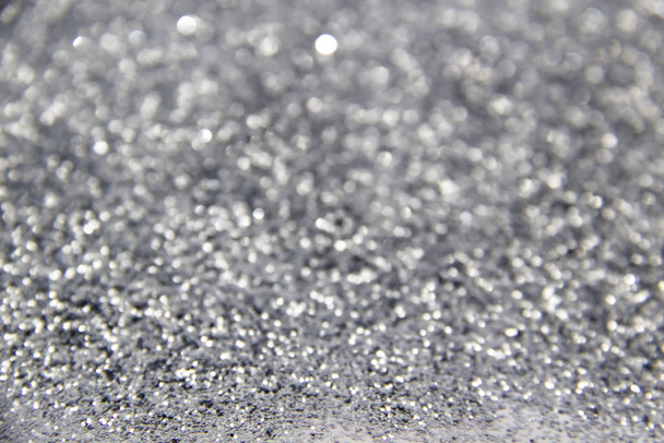 A composition with  beautiful silver glitter. Background and texture of silver glitter. Luxury silver glitter sparkle shining texture background - Photo, Image