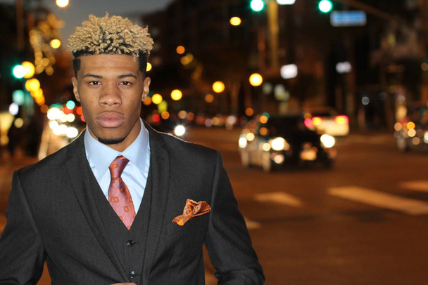 close-up portrait of handsome young african american businessman on street at night - Photo, Image