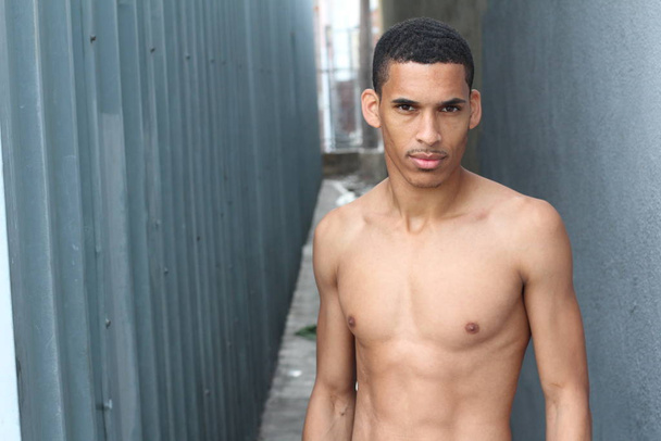 close-up portrait of handsome young shirtless african american man on street - Photo, Image